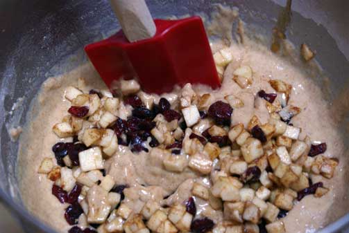 folding-in-apples-and-cranb folding in apples and cranb Cranberry Apple Muffins