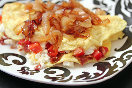 omelets with caramelized onions and bacon crumbles