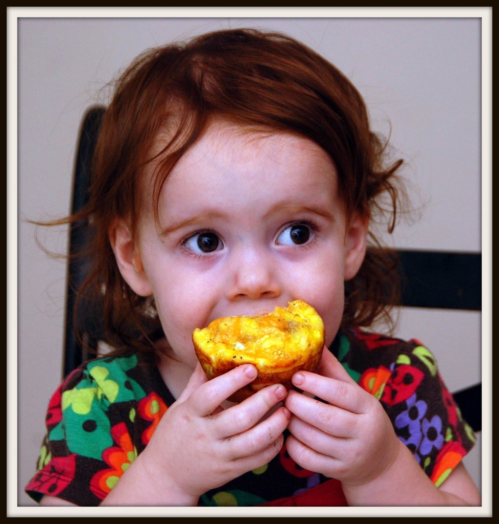 Vivi eating an egg biscuit