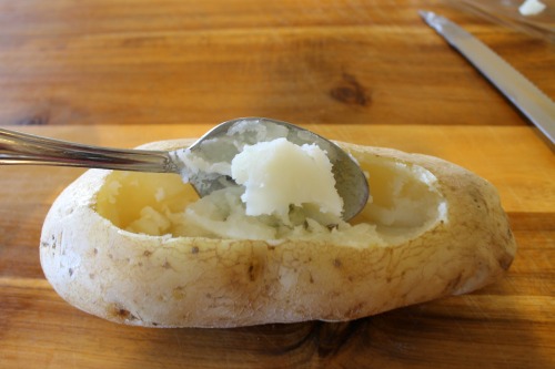 To make white chili stuffed potatoes, scoop the inside of a baked potato out