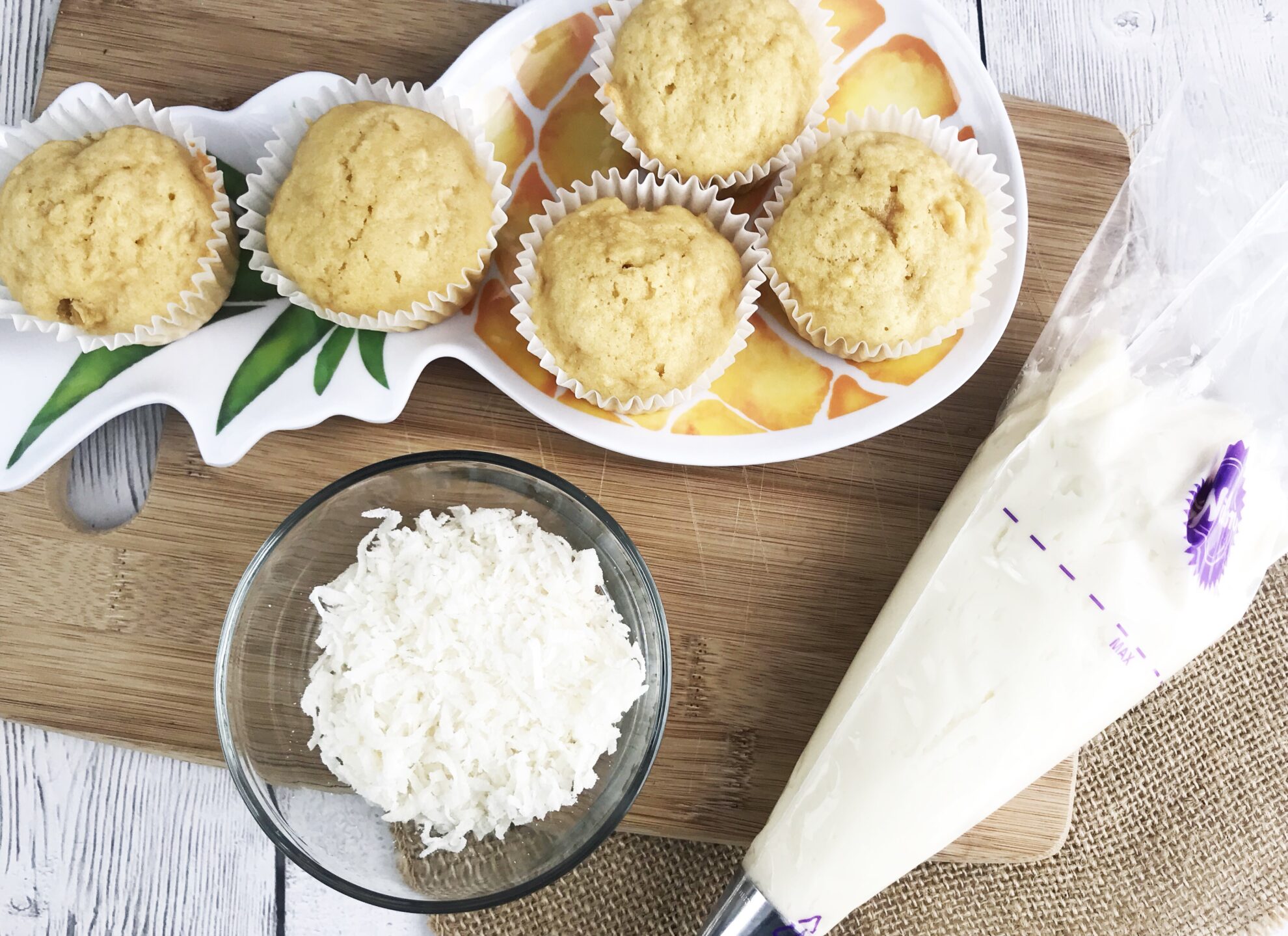 These Pineapple Cupcakes will whisk you away to the Tropics! The perfect refreshing dessert as a snack or for a birthday on 5DollarDinners!