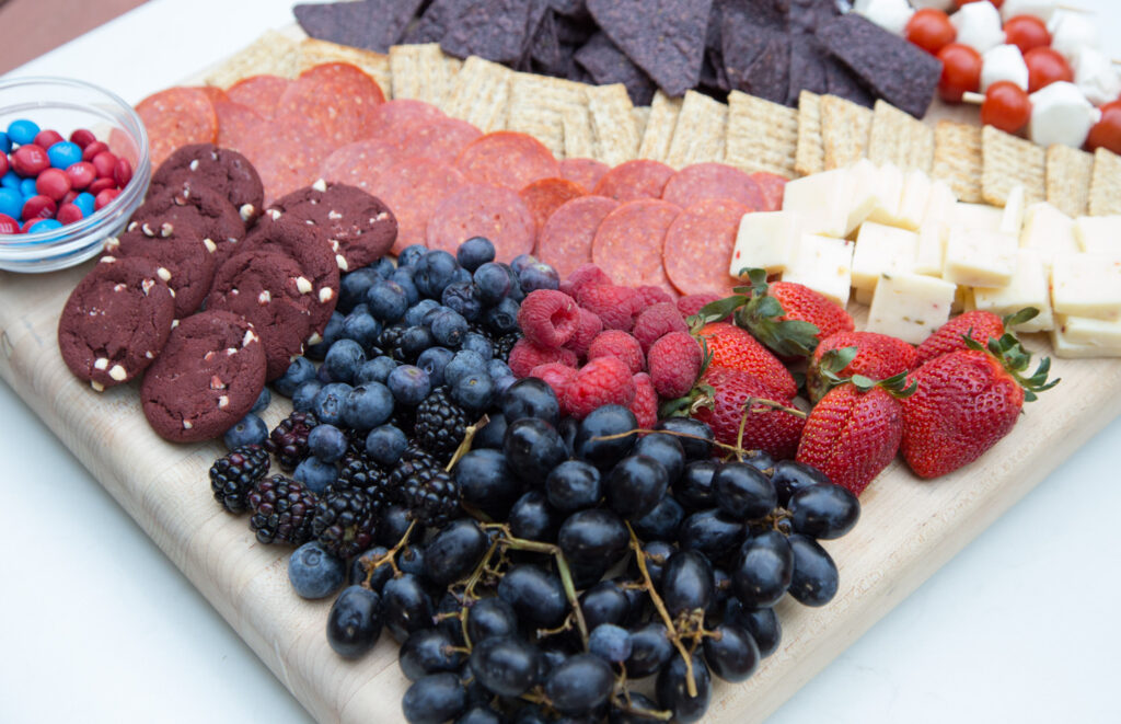 patriotic themed red white and blue charcuterie board